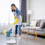 part time helper singapore - house cleaning services singapore - getty - woman mopping the floor