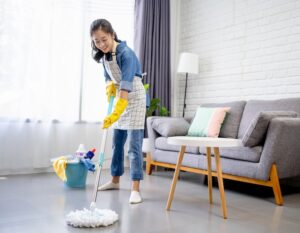 part time helper singapore - house cleaning services singapore - getty - woman mopping the floor