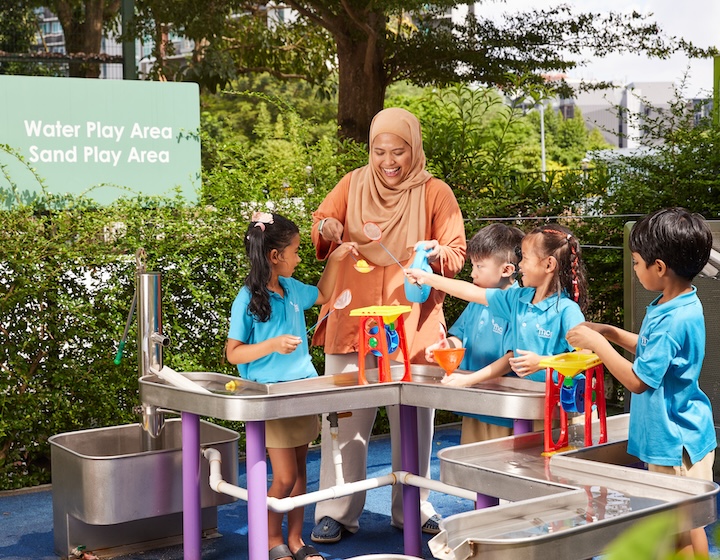 preschool singapore - MOE kindergarten - teacher and students in outdoor space