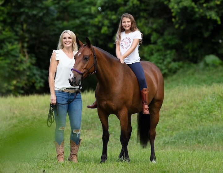 horse riding in singapore - atoms polo academy - mother and daughter riding a horse