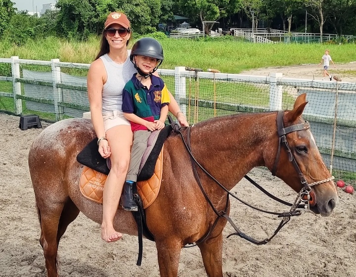 horse riding in singapore - colt polo & riding - mom and son riding a horse